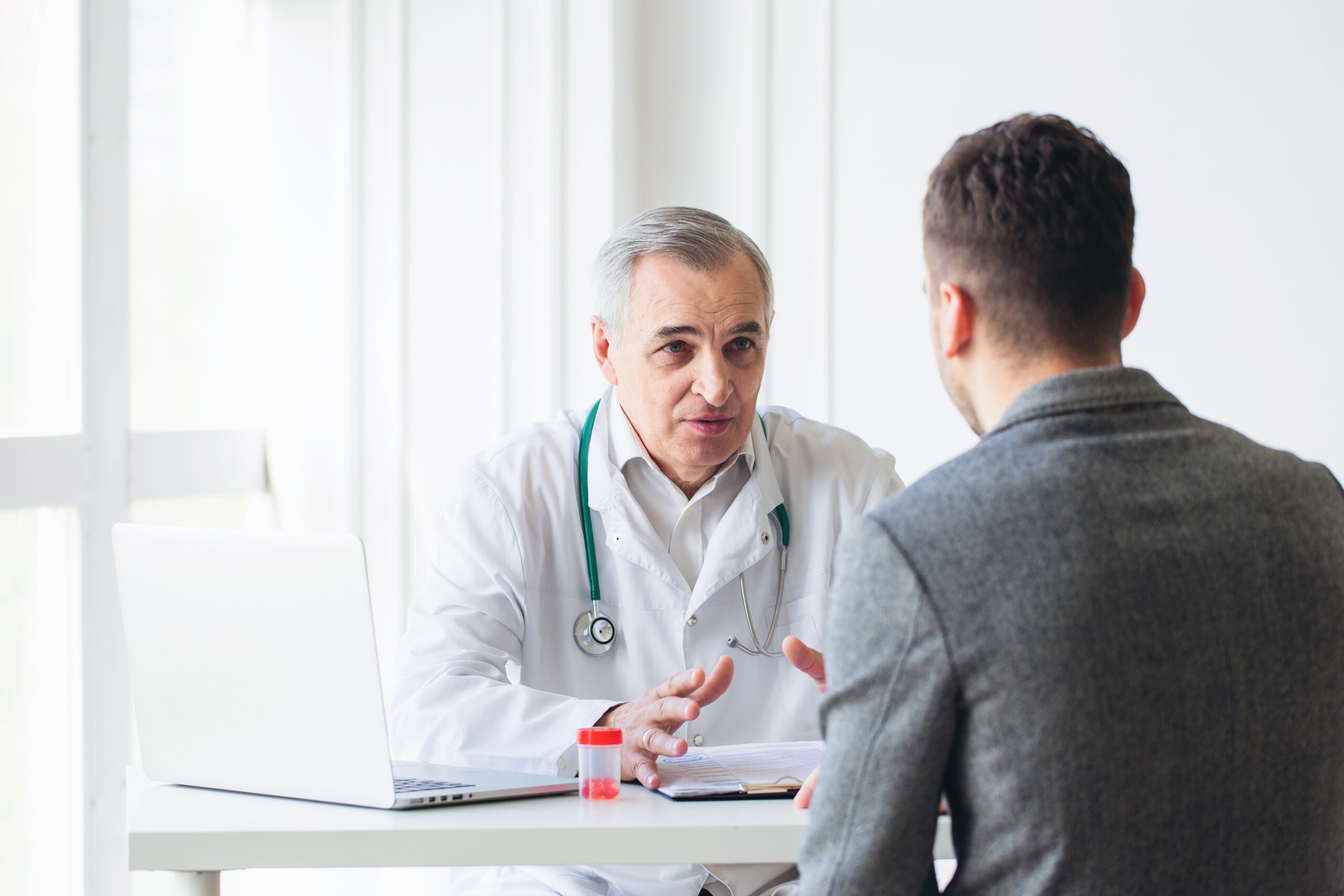 Doctor talking with patient