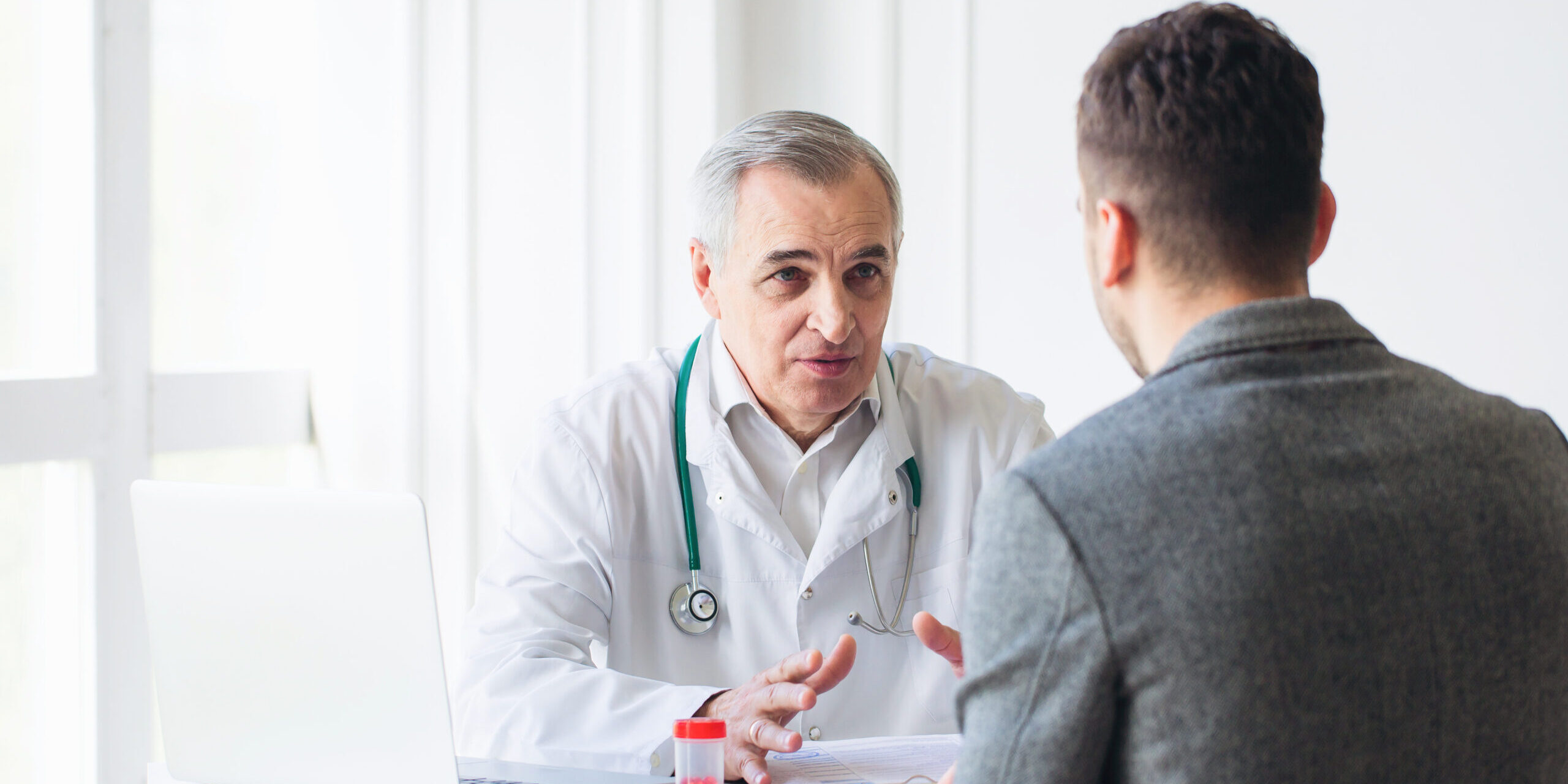 Doctor talking with patient