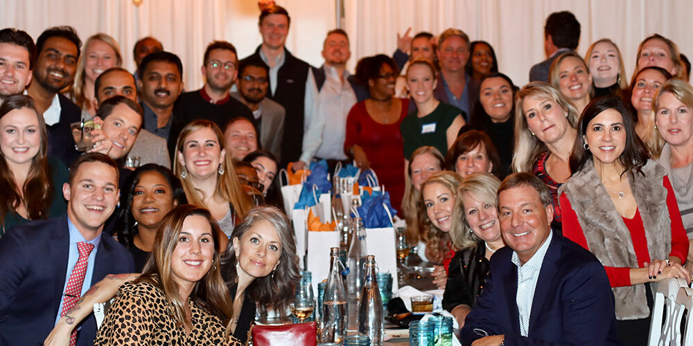 Members of the RXNT team pose together at a holiday party